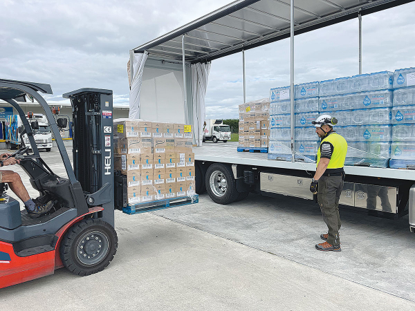 Anchor UHT milk being loaded at Fonterra depot in Hastings for delivery by road and air to Hawke’s Bay residents last week.
